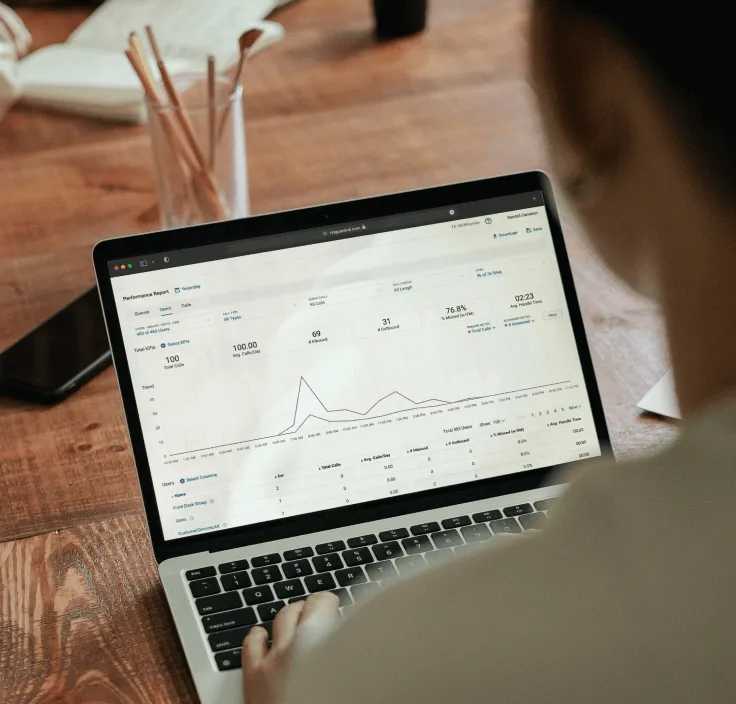 A woman viewing sales data and insights extracted from RingCentral Analytics