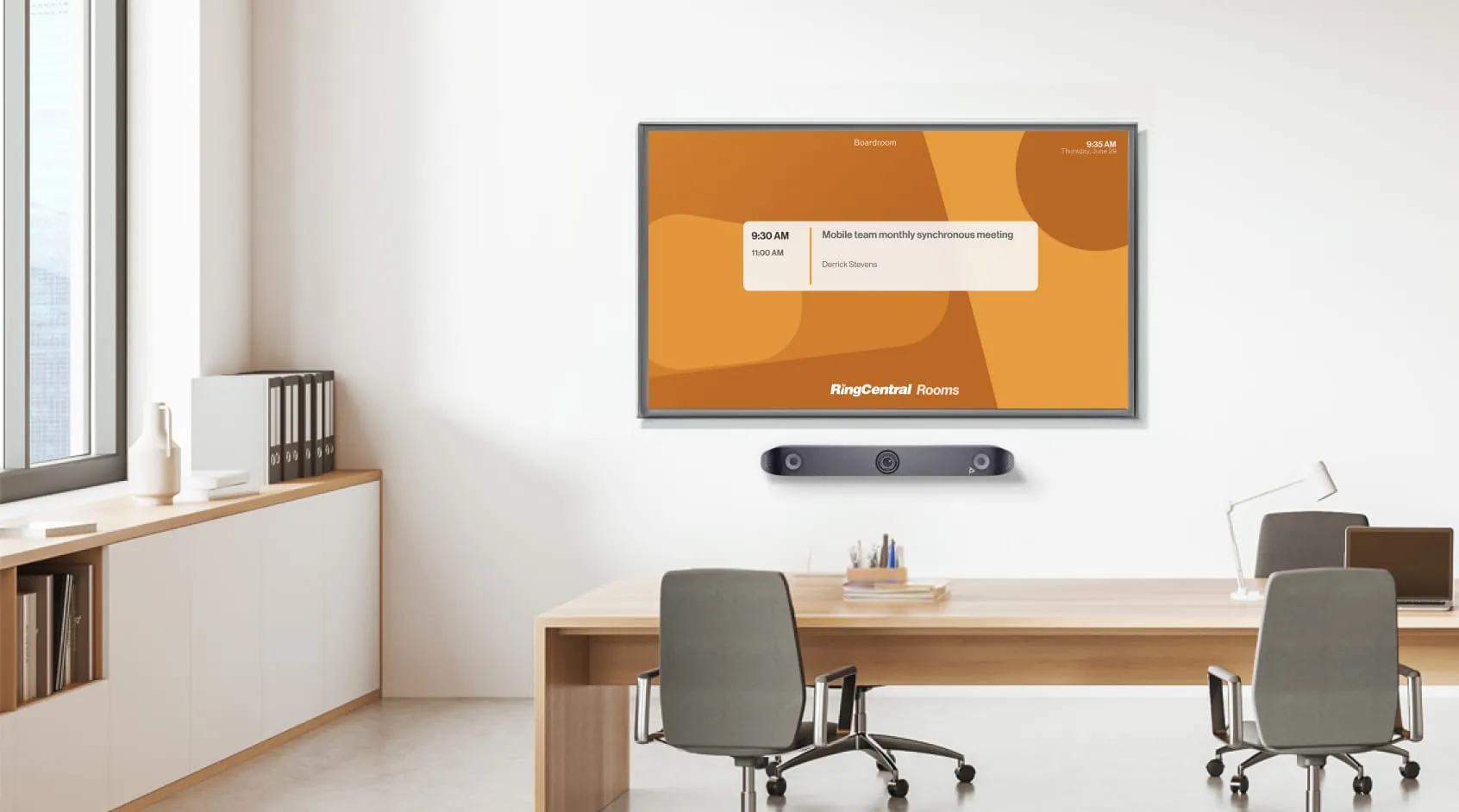 A medium sized meeting room with four chairs