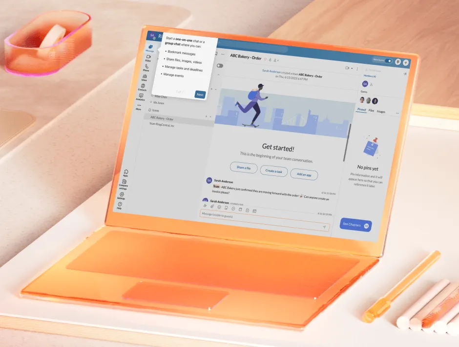 The RingCentral App on the screen of an orange laptop above a wooden desk