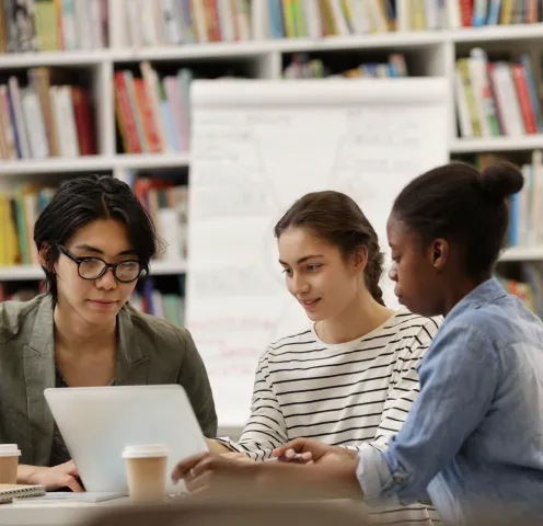 A group of three individuals planning and organizing a virtual event to be hosted on RingCentral Events